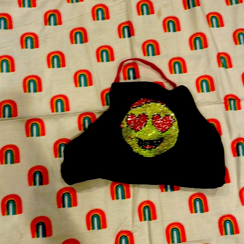 This is a black swimsuit with flippy sweet queens in the front